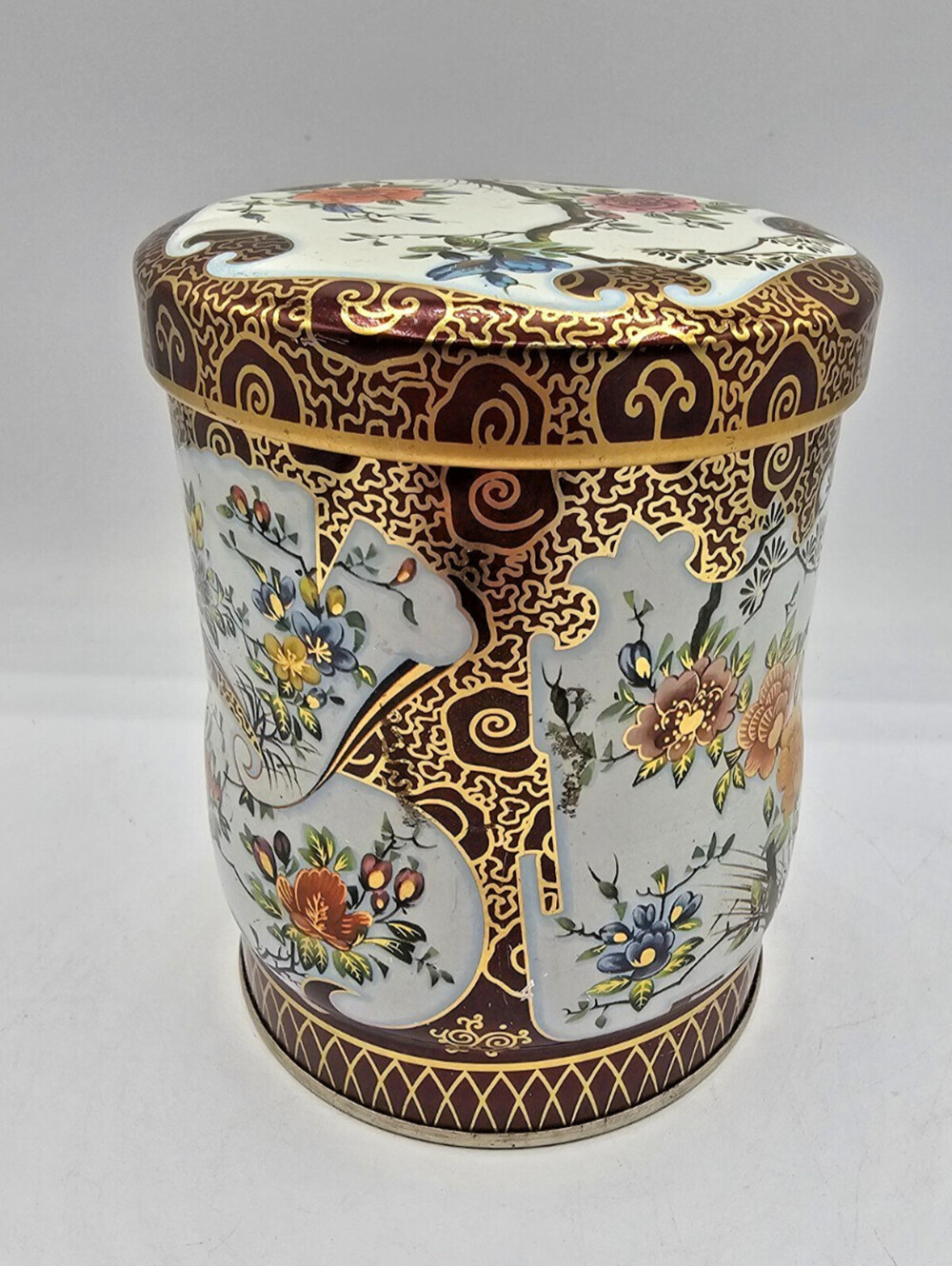 vintage Daher cylindrical tin with a floral and Chinoiserie-inspired design